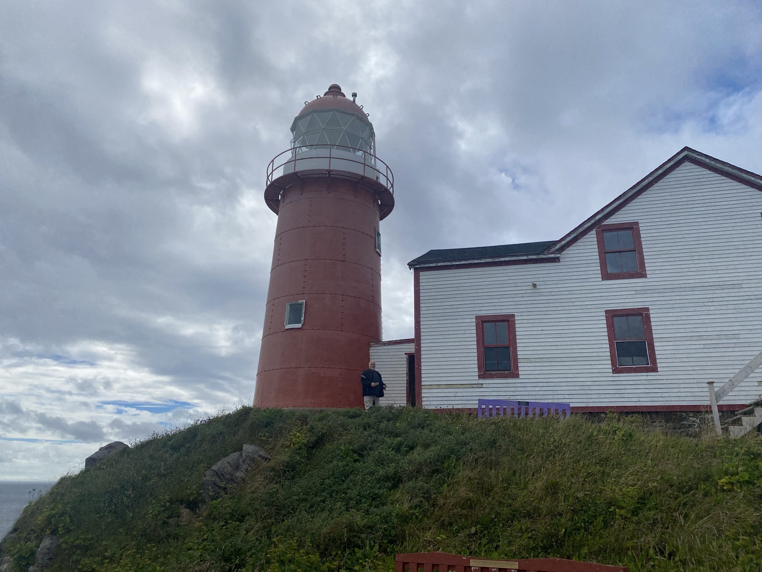 The Ferryland lighthouse in Newfoundland. Chuck is at the base of the lighthouse for scale.
