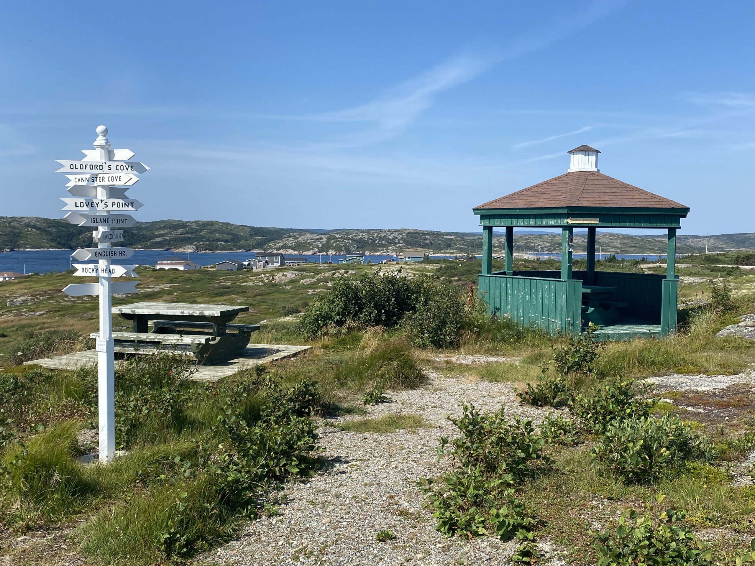 A gazebo and signpost at the Sealing Captains park in Greenspond, on Wings Island, in Newfoundland.