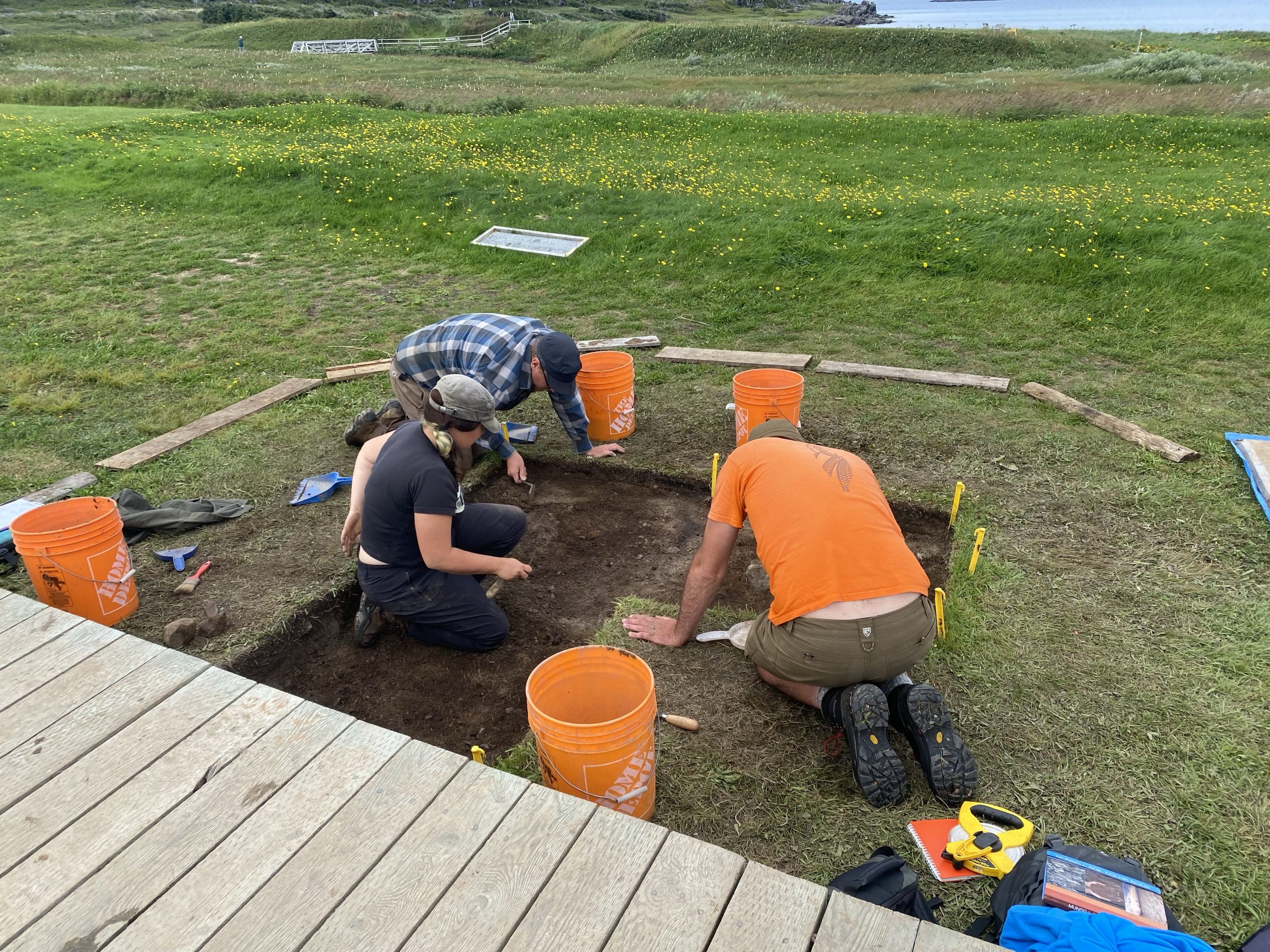 A UNESCO archeological team doing an active dig adjacent to one of the sod house remnants.