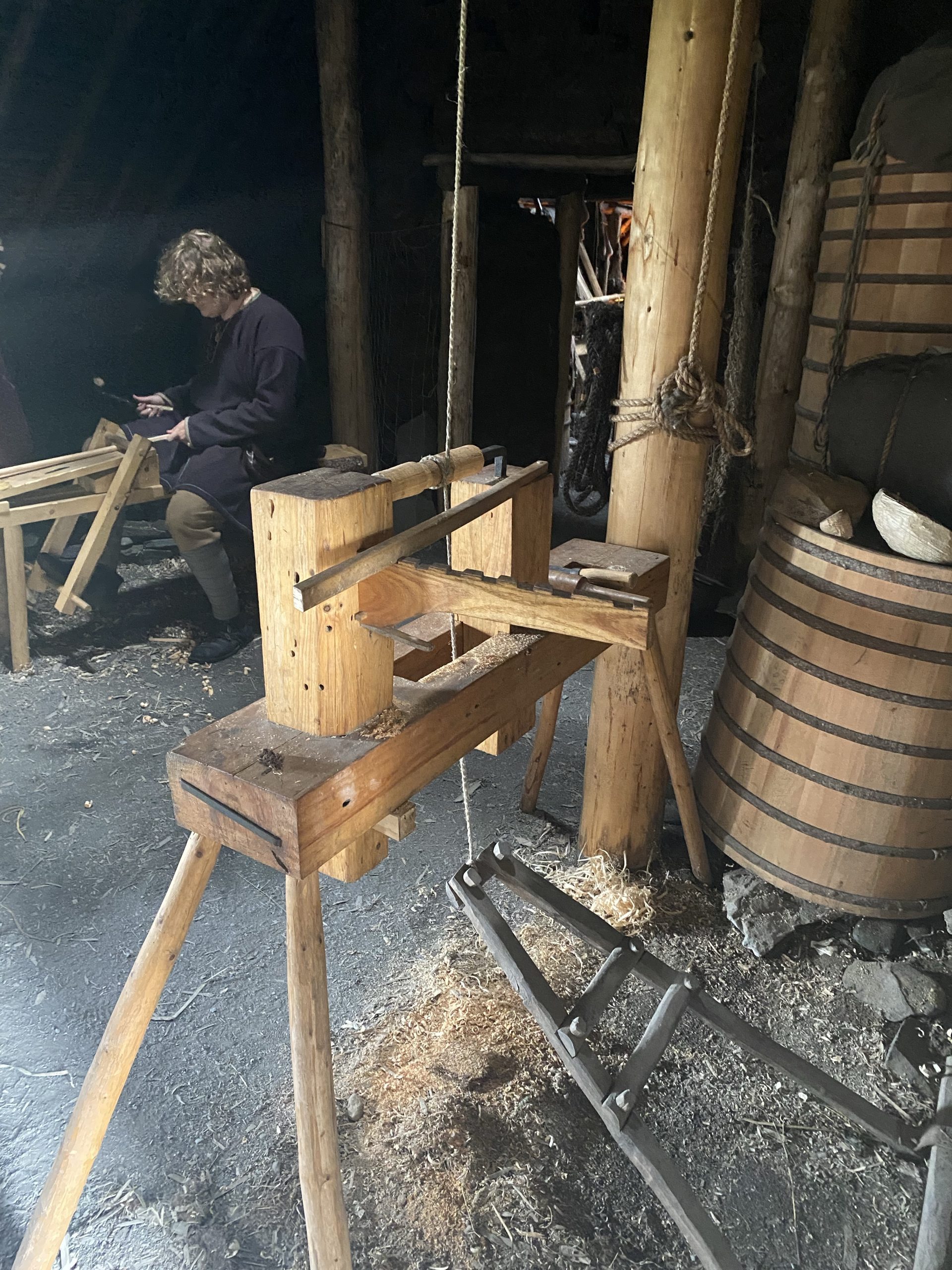 A foot/spring driven reciprocating wood lathe in a re-creation of a 1,000 year old Norse sod house.