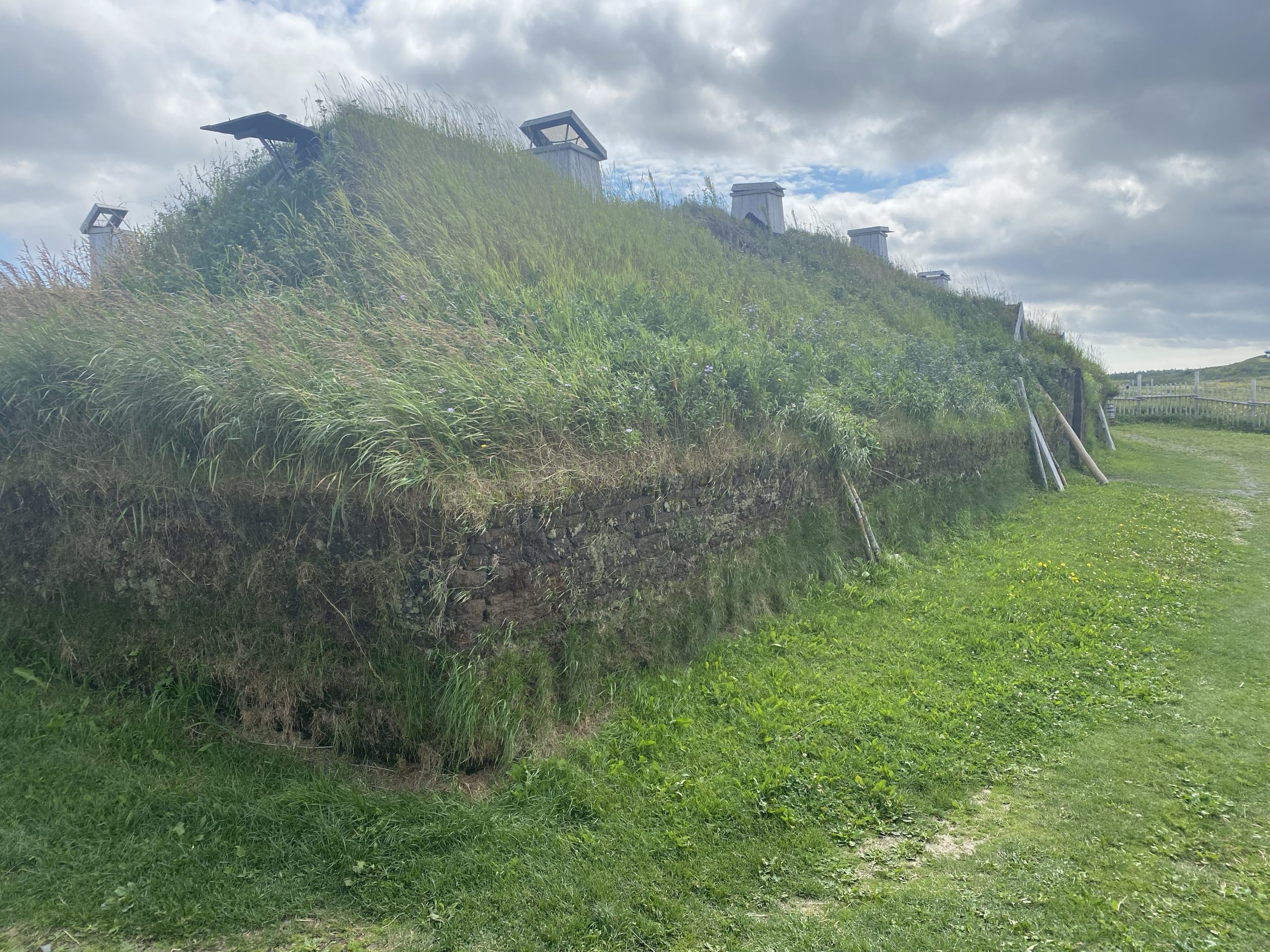 A side view of a re-creation of a 1,000 year old Norse sod house.