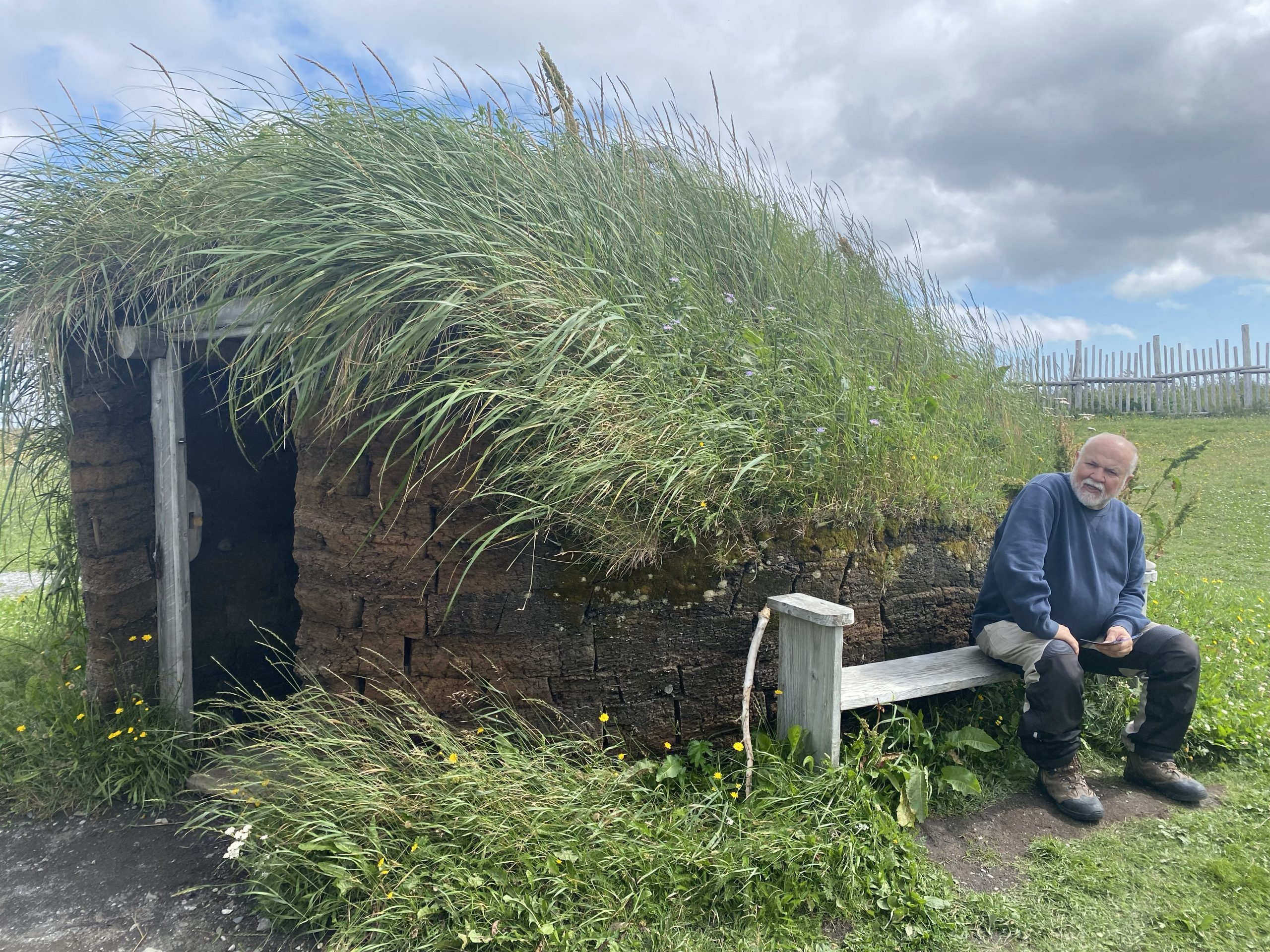 Chuck sits next to a re-creation of a 1,000 old small Norse sod house. This may have been an efficiency apartment, or (more likely) a food storage building.