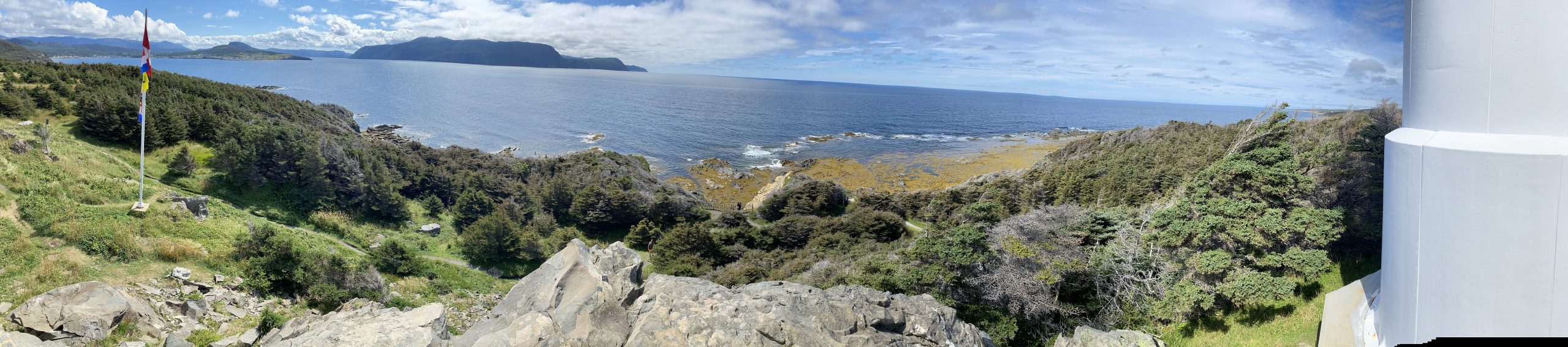 A panoramic view of Bonne Bay from Rocky Harbour on the left to the Lobster Cove lighthouse on the right, in Newfoundland.