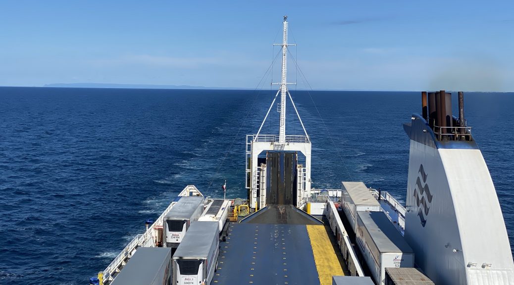 Looking over the stern of the MV Highlanders ferry from Newfoundland to Nova Scotia. You can still see Newfoundland on the horizon over the stern.