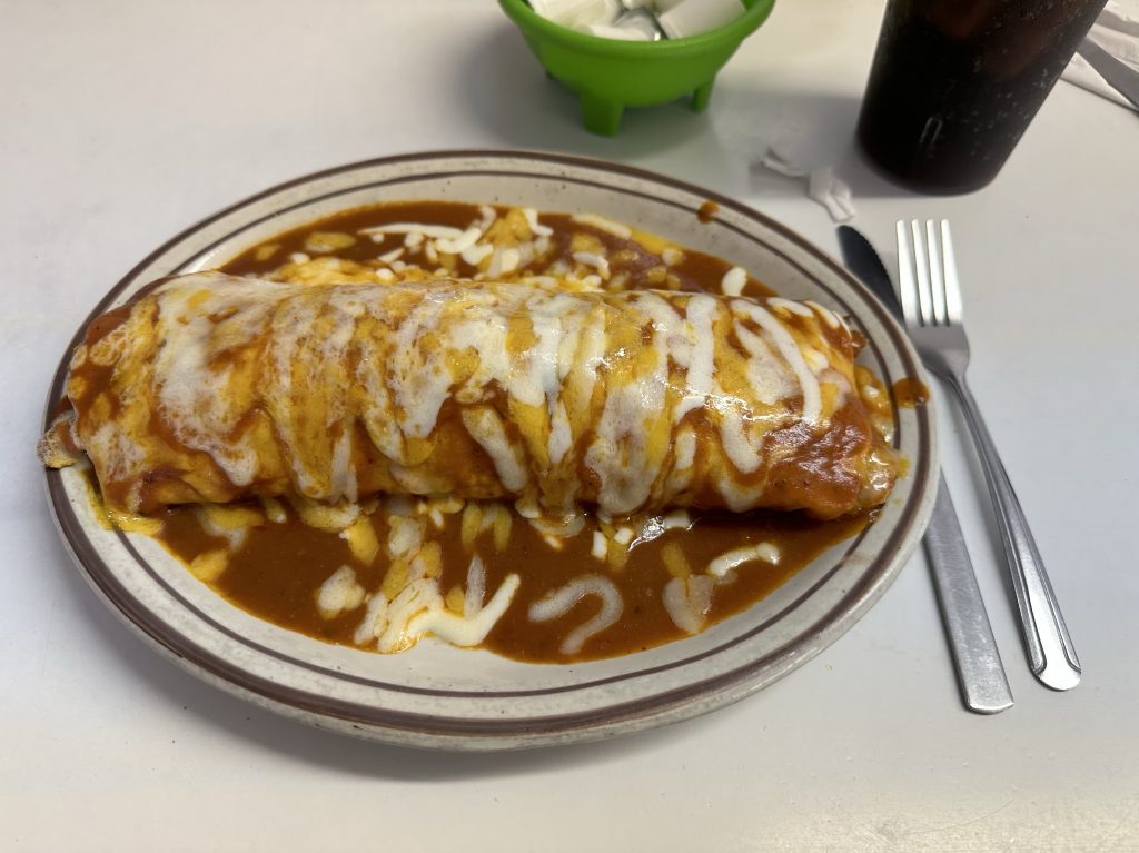 My huge breakfast burrito at La Escondida Cafe in Roswell, New Mexico. I chose eggs, potatoes, chorizo, onions, and red sauce. Delicious.
