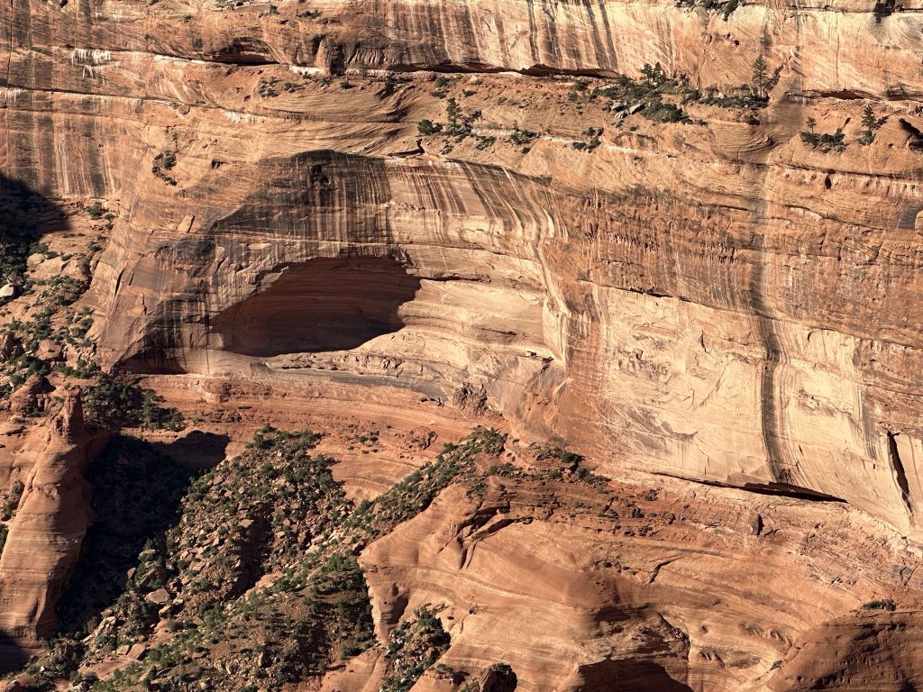 Some ruins in the distant arch from the Face Rock overlook at Canyon De Chelly.