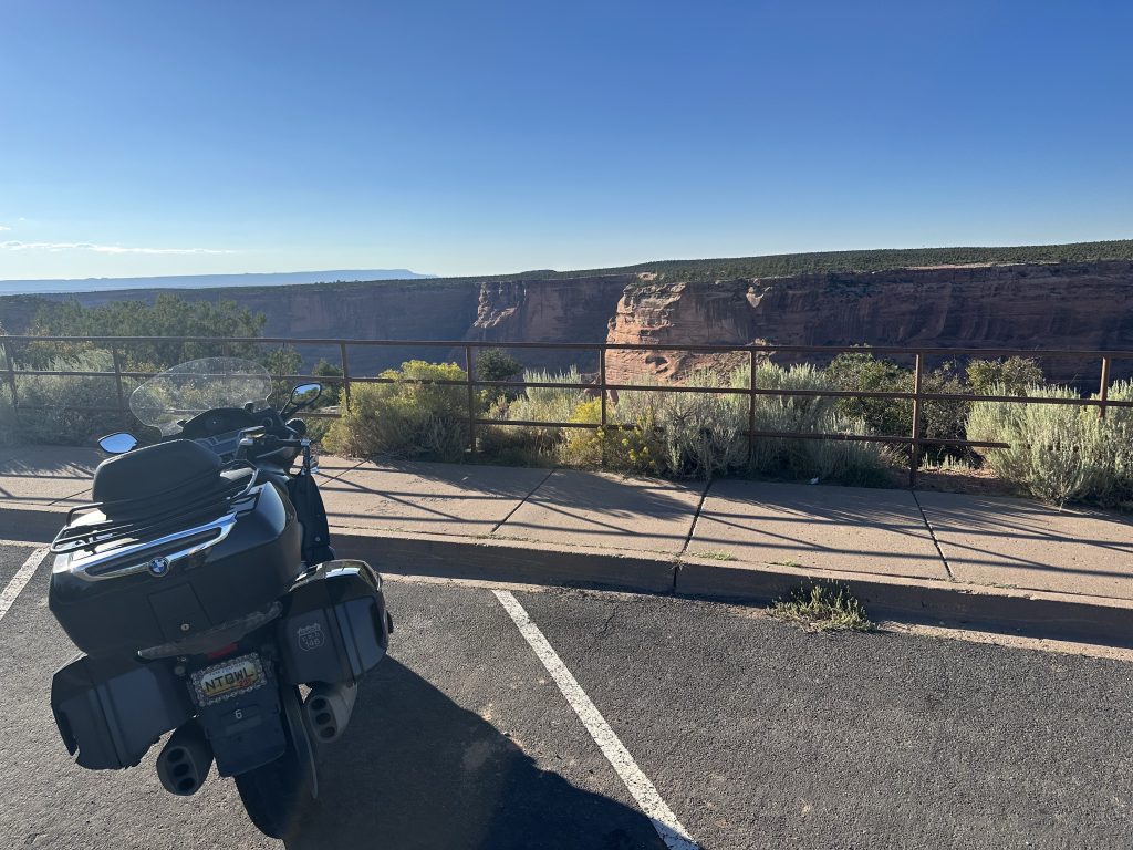 The Nightowl waits in the parking area while I hike to the Spider Rock overlook at Canyon De Chelly.